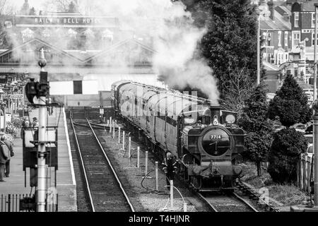 Front view of an old steam locomotive with coal for heating the boiler ...