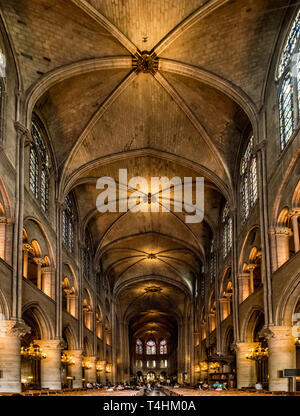 Paris, France, March 27, 2017: Interior of the Notre Dame de Paris. The cathedral of Notre Dame is one of the top tourist destinations in Paris Stock Photo