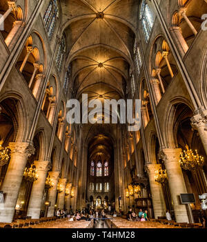 Paris, France, March 27, 2017: Interior of the Notre Dame de Paris. The cathedral of Notre Dame is one of the top tourist destinations in Paris Stock Photo