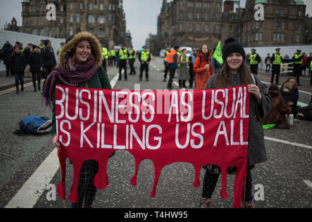 Edinburgh, Scotland, 16th April 2019. Extinction Rebellion (Scotland) climate protestors shut North Bridge to traffic during an 'International Day of Rebellion', asking for the government to declare a climate emergency, in Edinburgh, Scotland, on 16 April 2019. Credit: Jeremy Sutton-Hibbert/Alamy Live News Stock Photo