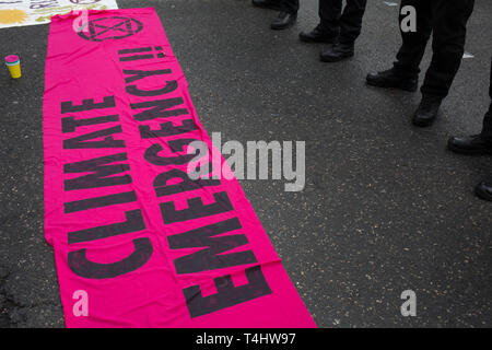 Edinburgh, Scotland, 16th April 2019. Extinction Rebellion (Scotland) climate protestors shut North Bridge to traffic during an 'International Day of Rebellion', asking for the government to declare a climate emergency, in Edinburgh, Scotland, on 16 April 2019. Credit: Jeremy Sutton-Hibbert/Alamy Live News Stock Photo