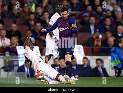 Barcelona, Spain. 16th Apr, 2019. FC Barcelona's Lionel Messi (R) vies with Manchester United's Ashley Young during the UEFA Champions League quarterfinal second leg soccer match between FC Barcelona and Manchester United in Barcelona, Spain, on April 16, 2019. Barcelona won 3-0 and entered the semifinal with a total score of 4-0. Credit: Joan Gosa/Xinhua/Alamy Live News Stock Photo