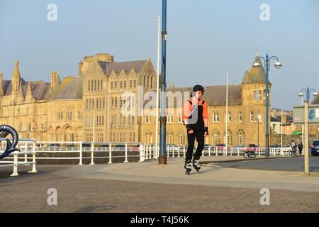 Aberystwyth Ceredigion Wales UK, Wednesday 17 April 2019. People enjoying a gloriously sunny and warm April spring evening with clear blue skies in Aberystwyth Wales, as the weather is set to improve as the country heads into the Easter Bank Holiday weekend photo Credit: Keith Morris/Alamy Live News Stock Photo