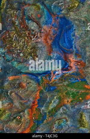 Abstract art with gold, green, orange, and blue flowing patterns. Stock Photo
