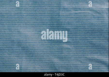 Wrinkled blue paper background close up view Stock Photo