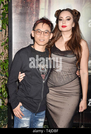 HOLLYWOOD, CA - APRIL 15: James Wan (L) and Ingrid Bisu arrive at the premiere of Warner Bros' 'The Curse Of La Llorona' at the Egyptian Theatre on April 15, 2019 in Hollywood, California. Stock Photo