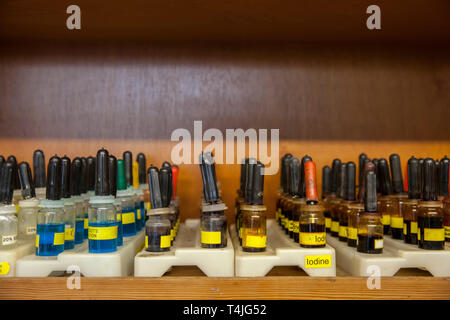 Iodine droppers in storage in a schools science department. Stock Photo