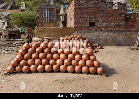 Traditional clay water pots near house in Amber village. India Stock Photo