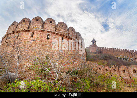 Ancient long wall with towers around Amber Fort. Jaipur. Rajasthan. India Stock Photo