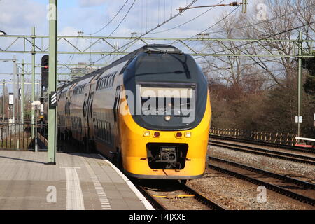 VIRM intercity double decker train at the trainstation of Den Haag Laan van NOI in the Netherlands Stock Photo