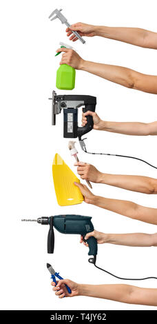 set of the tools for home repair in hands on white background, vertical Stock Photo