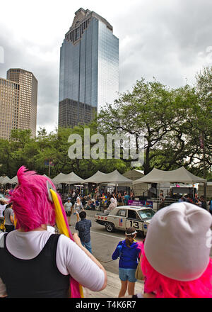 Houston, Texas / United States - April 13th 2019: A onlookers observe the Annual Houston Art Car Parade despite a brief rain shower Stock Photo