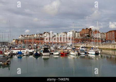 View across boats moored in the Inner Marina of the Royal Harbour Marina in Ramsgate, Kent, UK. Stock Photo
