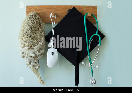 Career Concept With Tools Associated With Different Professions Hanging On Wall Rack Stock Photo