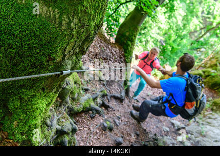 Good-humoured couple hiking on challenging Jägersteig in Altmühltal Stock Photo