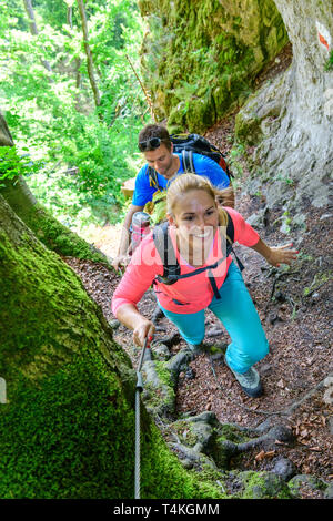 Good-humoured couple hiking on challenging Jägersteig in Altmühltal Stock Photo