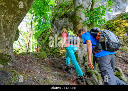 Good-humoured couple hiking on challenging Jägersteig in Altmühltal Stock Photo