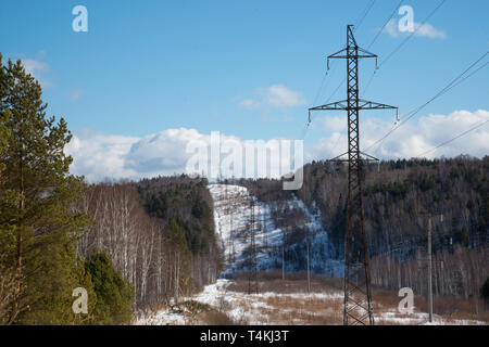 power line in the winter forest Stock Photo