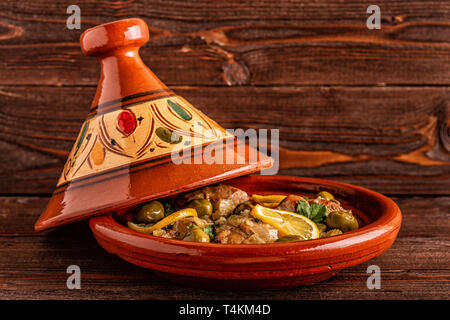 Traditional Moroccan chicken tagine with olives and salted lemons, selective focus. Stock Photo