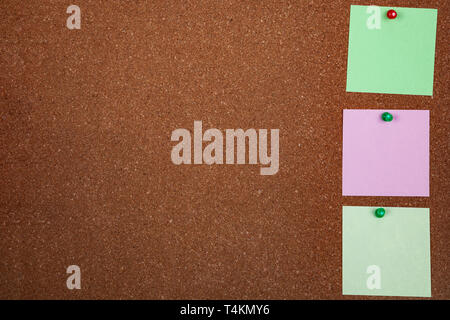 Three sheets of paper on corkboard. Place for your text. Stock Photo