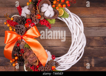 Christmas wreath on a wooden  background Stock Photo