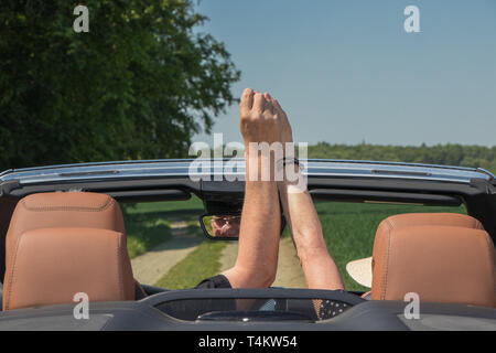 Senior couple in sports car Stock Photo