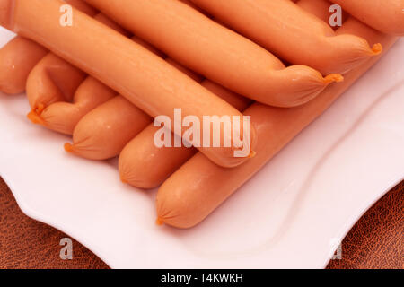 raw sausages isolated on white background. Top view Stock Photo
