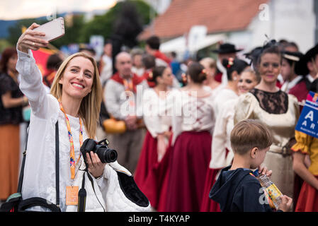 Members of asociación Artístico Cultural de Tango y Folclore Nuestras Raíces from Rosario, Argentina during the procession at 30th Folkart International CIOFF Folklore Festival, folklore sub-festival of Festival Lent, one of the largest outdoor festivals in Europe. Folkart, Festival Lent, Maribor, Slovenia, 2018. Stock Photo