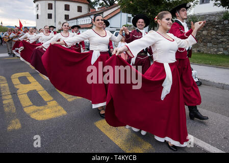Members of asociación Artístico Cultural de Tango y Folclore Nuestras Raíces from Rosario, Argentina during the procession at 30th Folkart International CIOFF Folklore Festival, folklore sub-festival of Festival Lent, one of the largest outdoor festivals in Europe. Folkart, Festival Lent, Maribor, Slovenia, 2018. Stock Photo