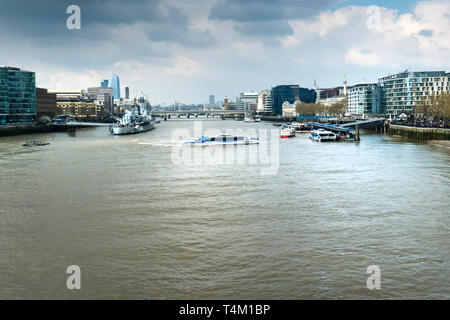A Thames Clipper boat manoeuvering on the River Thames in London. Stock Photo