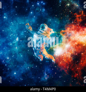 Among the stars / 3D illustration of science fiction scene with astronaut floating in outer space amid glowing colourful galaxies Stock Photo