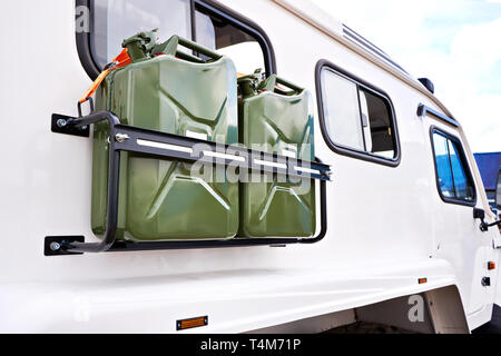 Canisters with fuel on car truck SUV Stock Photo