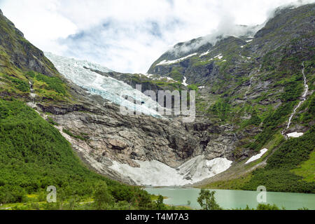 Landscape with river near Briksdal or Briksdalsbreen glacier in Olden, Norway with green mountain. Norway nature and travel background. Summer in Norw Stock Photo