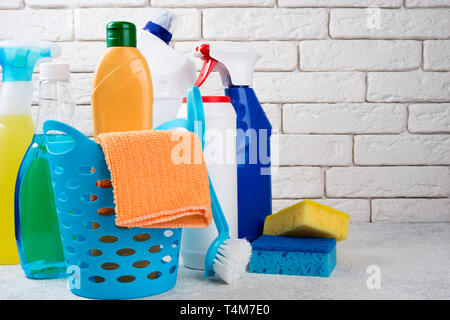 Basket with cleaning products on white background. Cleaning with supplies, cleaning service and clean house concept. Copy space Stock Photo