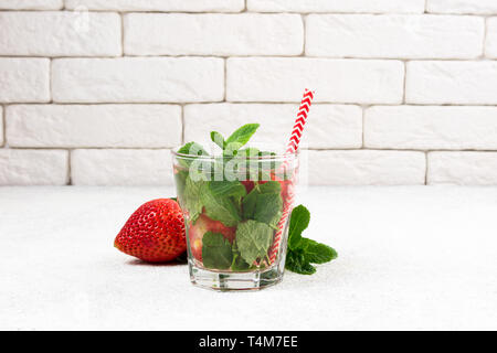 Strawberry infused water, coctail or lemonade. Summer drink with strawberry and mint. Copy space Stock Photo