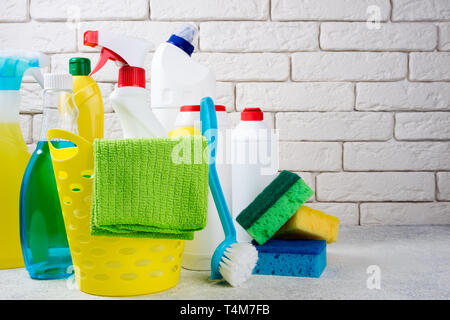 Basket with cleaning products on white background. Cleaning with supplies, cleaning service and clean house concept. Copy space Stock Photo