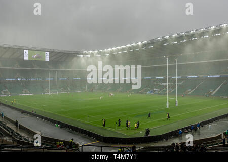 A very wet game of Rugby Union (Women's Oxford v Cambridge University Varsity game 2017) at Allianz Stadium, Twickenham in London, UK. Stock Photo