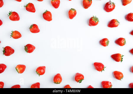 Strawberry on white background, top view. Berries pattern. Frame made of fresh strawberry on white background. Creative food concept. Flat lay, copy s Stock Photo