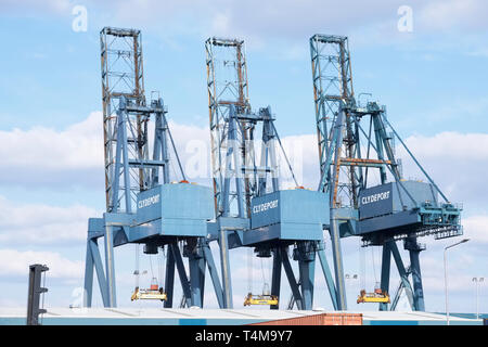Greenock, Inverclyde / Scotland - 04/16/2019: Clydeport carrier cranes for transportation lifting of containers and freight onto ships Stock Photo