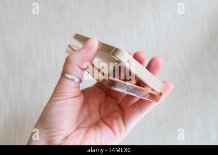 Silicone case for smartphone bent in his hand Stock Photo