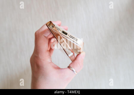 Silicone case for smartphone bent in his hand Stock Photo