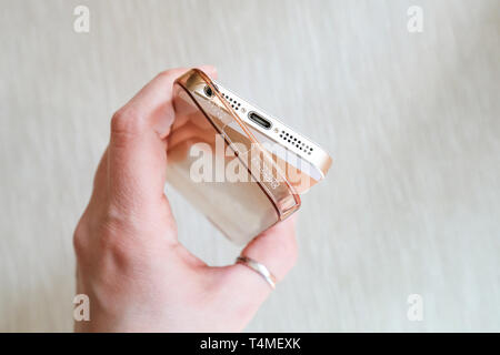 Silicone case for smartphone bent in his hand Stock Photo