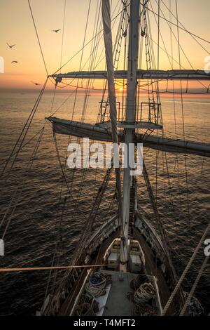 The view from the mast lookout of the Lord Nelson Sailing ship at sunset. Stock Photo