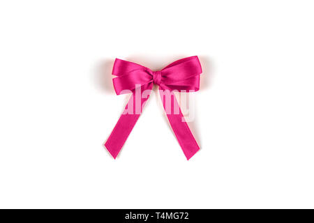 Shiny pink silk ribbon on white background. Stock Photo