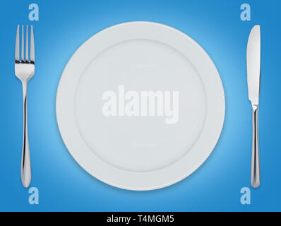 Empty clean dinner plate with knife and fork Stock Photo