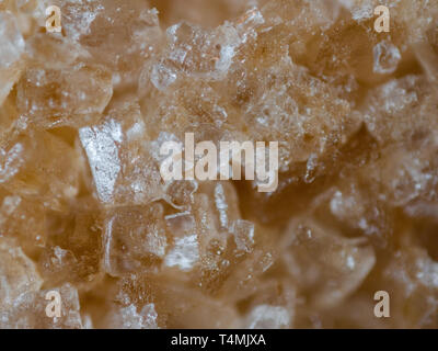 Extreme closeup of a brown sugar cube. Very shallow depth of field. Stock Photo