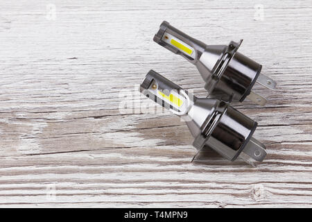 Light bulbs for car lamps isolated on wooden background Stock Photo