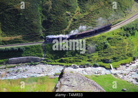 Steam train in the green valley Stock Photo