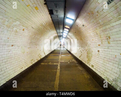 The Greenwich Foot Tunnel crosses beneath the River Thames in East London, linking Greenwich (Royal Borough of Greenwich) on the south bank with the Isle of Dogs (London Borough of Tower Hamlets) on the north Stock Photo