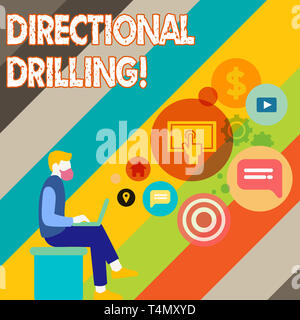 Writing note showing Directional Drilling. Business concept for drilling for oil which the well not drilled vertically Man Sitting with Laptop and SEO Stock Photo